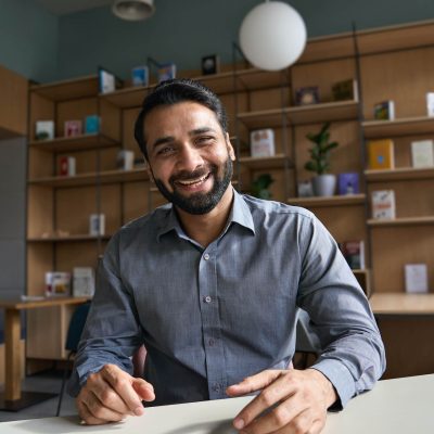 happy-indian-business-man-teacher-talking-to-web-2021-09-02-14-46-48-utc