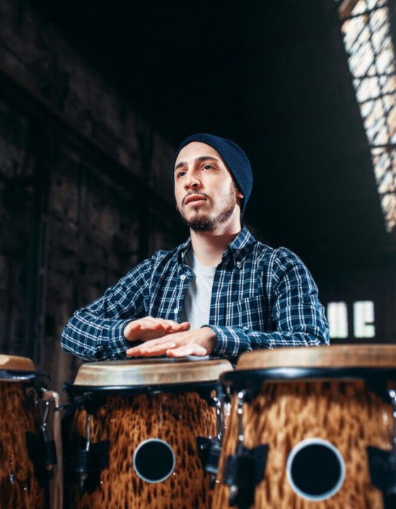 male-drummer-plays-on-wooden-drum-2021-08-26-16-26-01-utc