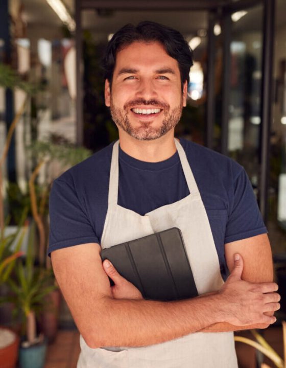 portrait-of-male-owner-of-florists-with-digital-ta-2021-08-27-16-33-27-utc