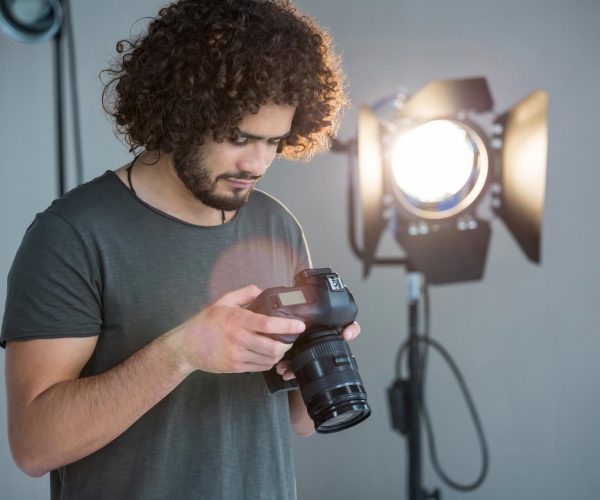 photographer-looking-at-the-photographs-in-the-cam-2021-08-28-17-19-32-utc